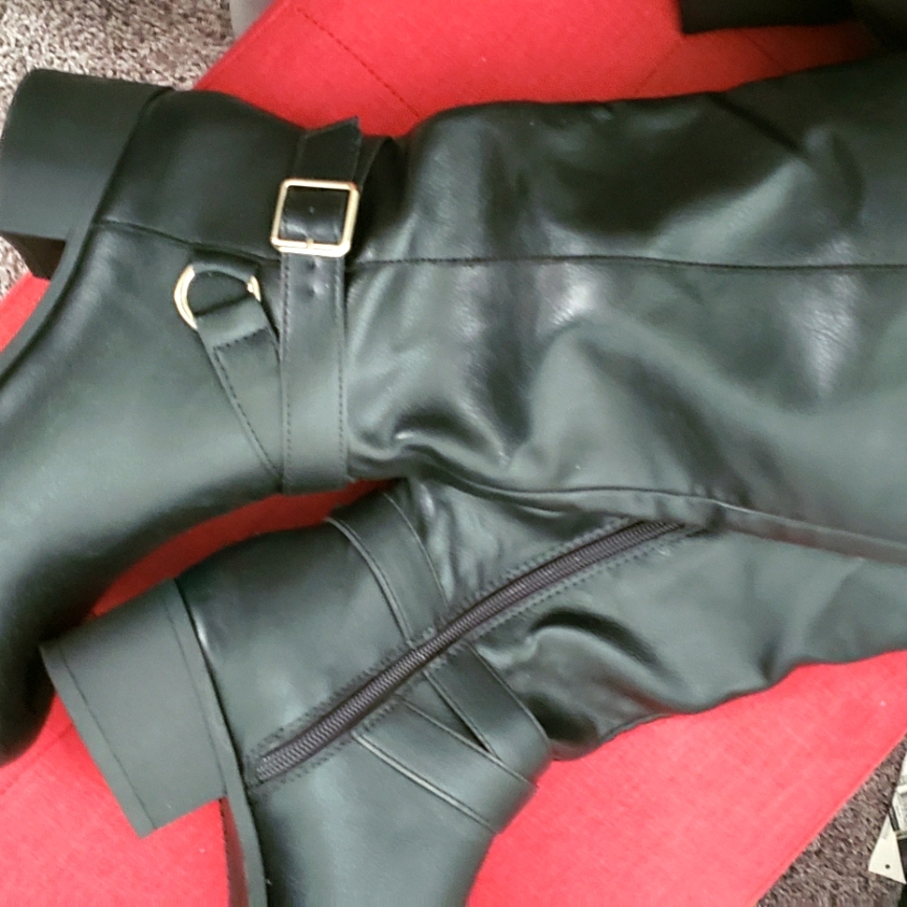 Black and tan man made leather boots